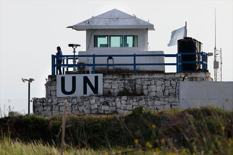 A member of the United Nations UN peace forces stands at a watchtower overlooking south Syria in the Israel-annexed Golan Heights, on March 25, 2025 (AFP photo)